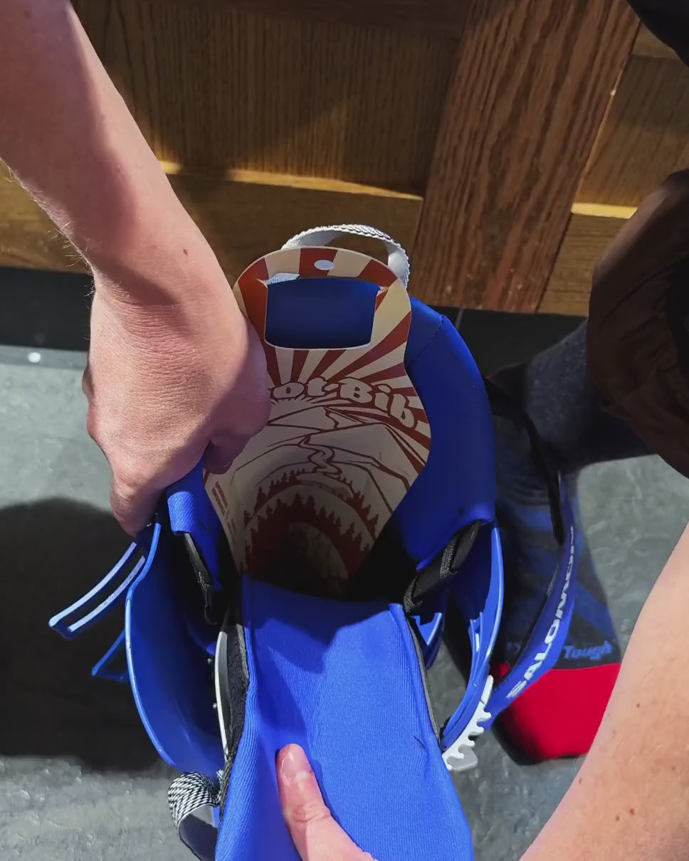 Boot Bib® in use: the foot slides into the ski boot, then the Boot Bib is pulled out